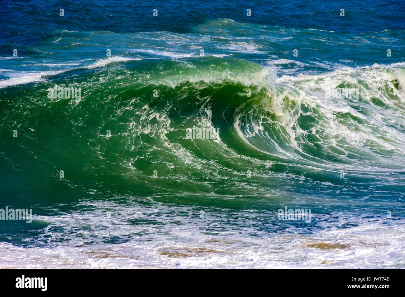 Big, dangerous waves during tropical storm in the green and blue waters ...