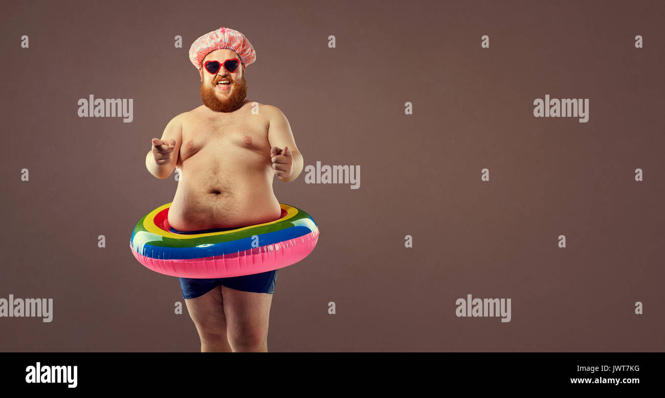 Fat funny man in an inflatable ring. Stock Photo