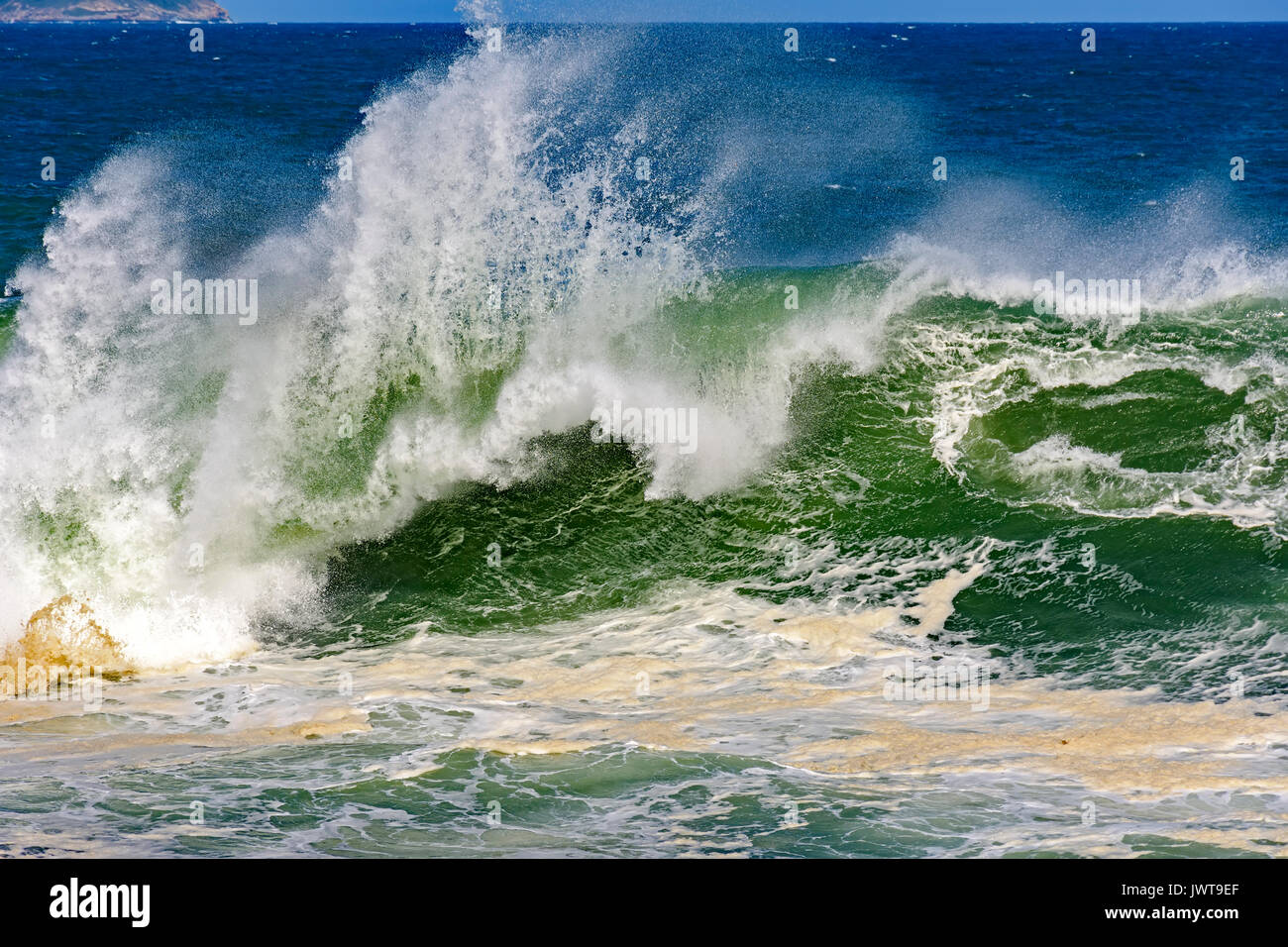 Big, dangerous waves during tropical storm in the green and blue waters ...