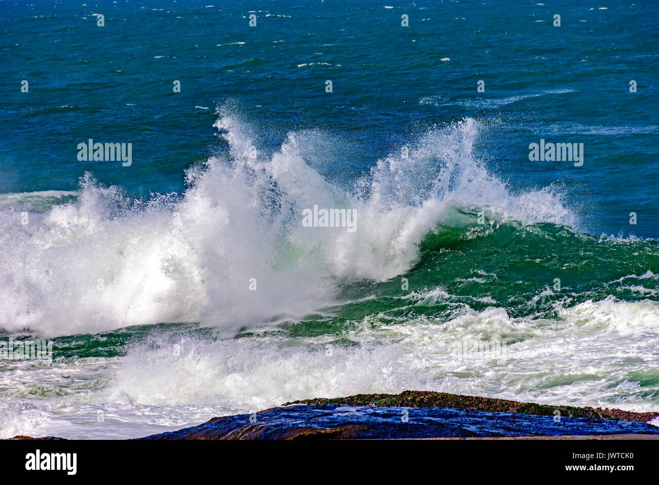 Big, dangerous waves during tropical storm in the green and blue waters ...