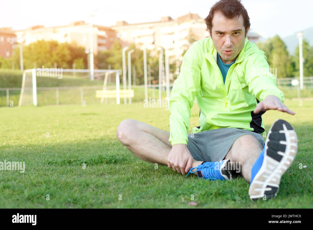 Sportsman exercising in a soccer field and preparing for the match Stock Photo