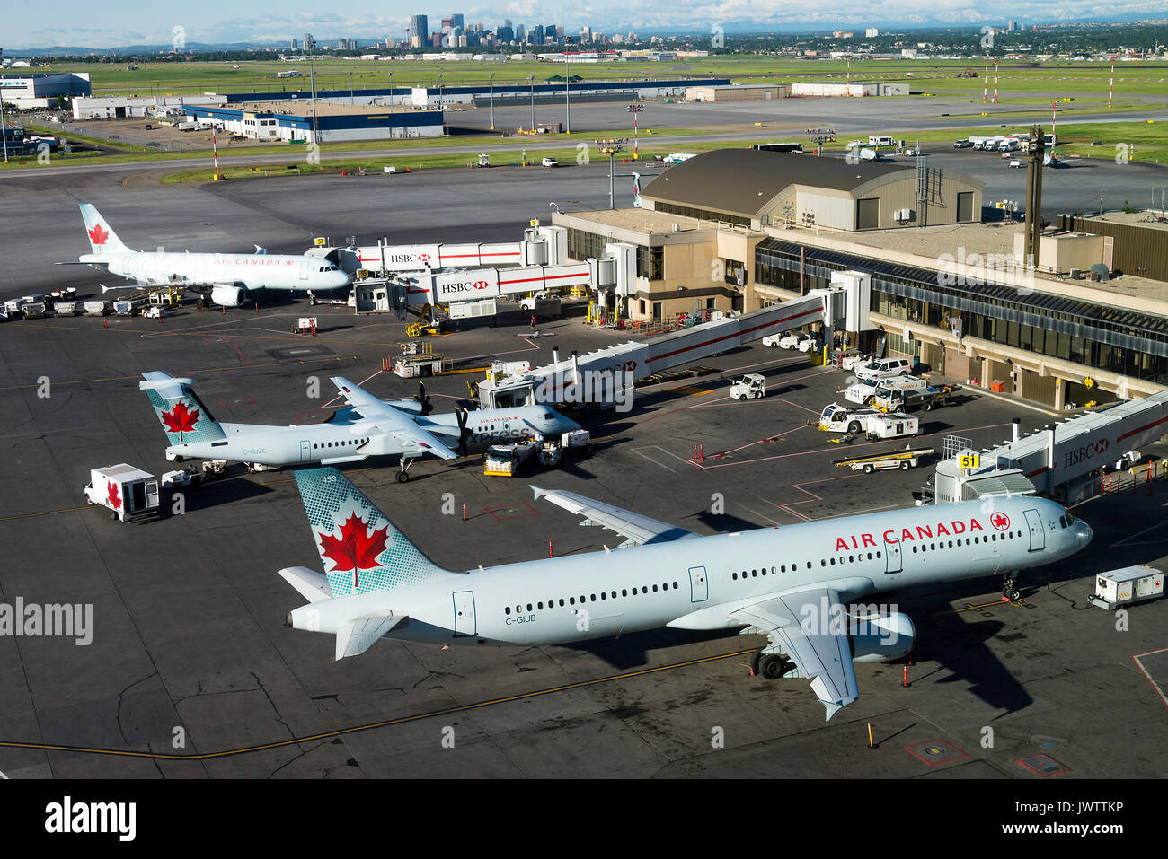 A Selection of Air Canada and Air Canada Express Airliners on Stand at Calgary International Airport Alberta Canada Stock Photo