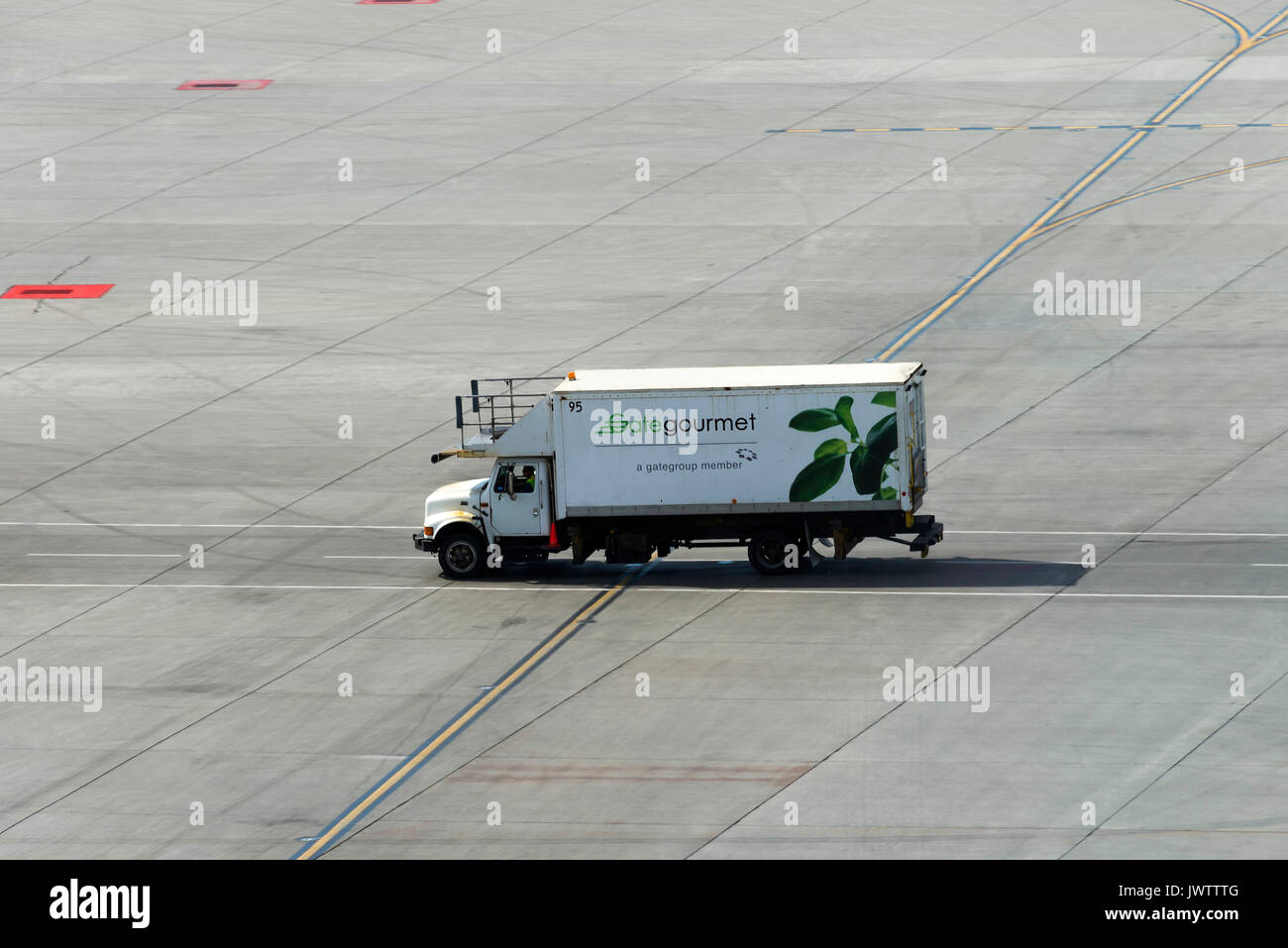 A Gate Gourmet Catering Truck About to Replenish an Aircraft with Food and Drinks on the Taxiway at Calgary International Airport Alberta Canada Stock Photo