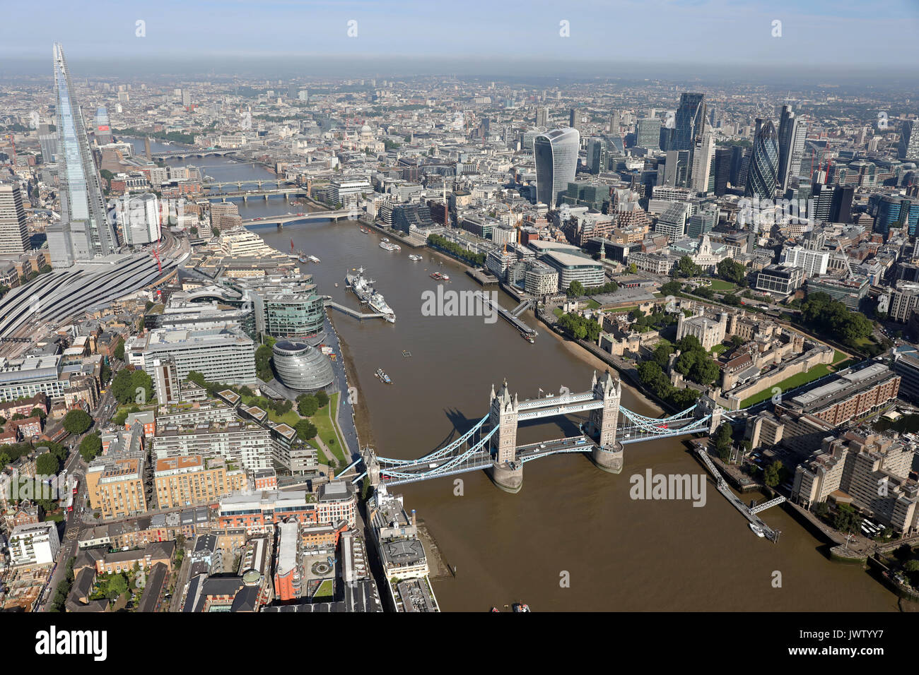 aerial view of Tower Bridge, Shard, Thames, & City of London skyline Stock Photo