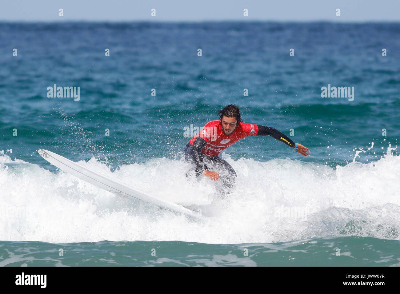 Fistral Beach, Newquay, Cornwall, UK. 13th Aug, 2017. Surfers take part in Day 5 of the Boardmasters Championship. This featured longboard surfers from around the world. Credit: Nicholas Burningham/Alamy Live News Stock Photo