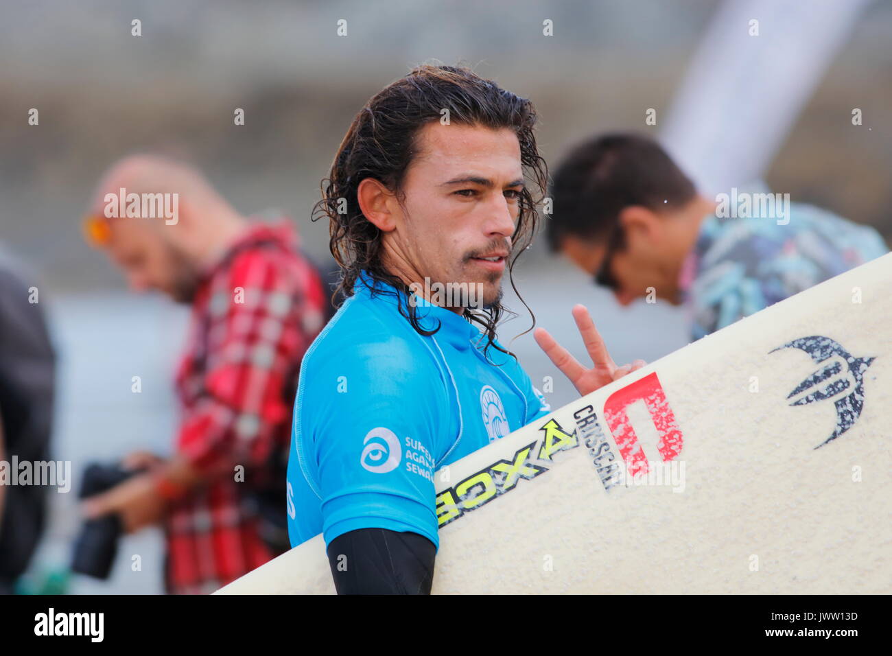 Fistral Beach, Newquay, Cornwall, UK. 13th Aug, 2017. Surfers take part in Day 5 of the Boardmasters Championship. This featured longboard surfers from around the world including Edouard Delpero seen here. Credit: Nicholas Burningham/Alamy Live News Stock Photo
