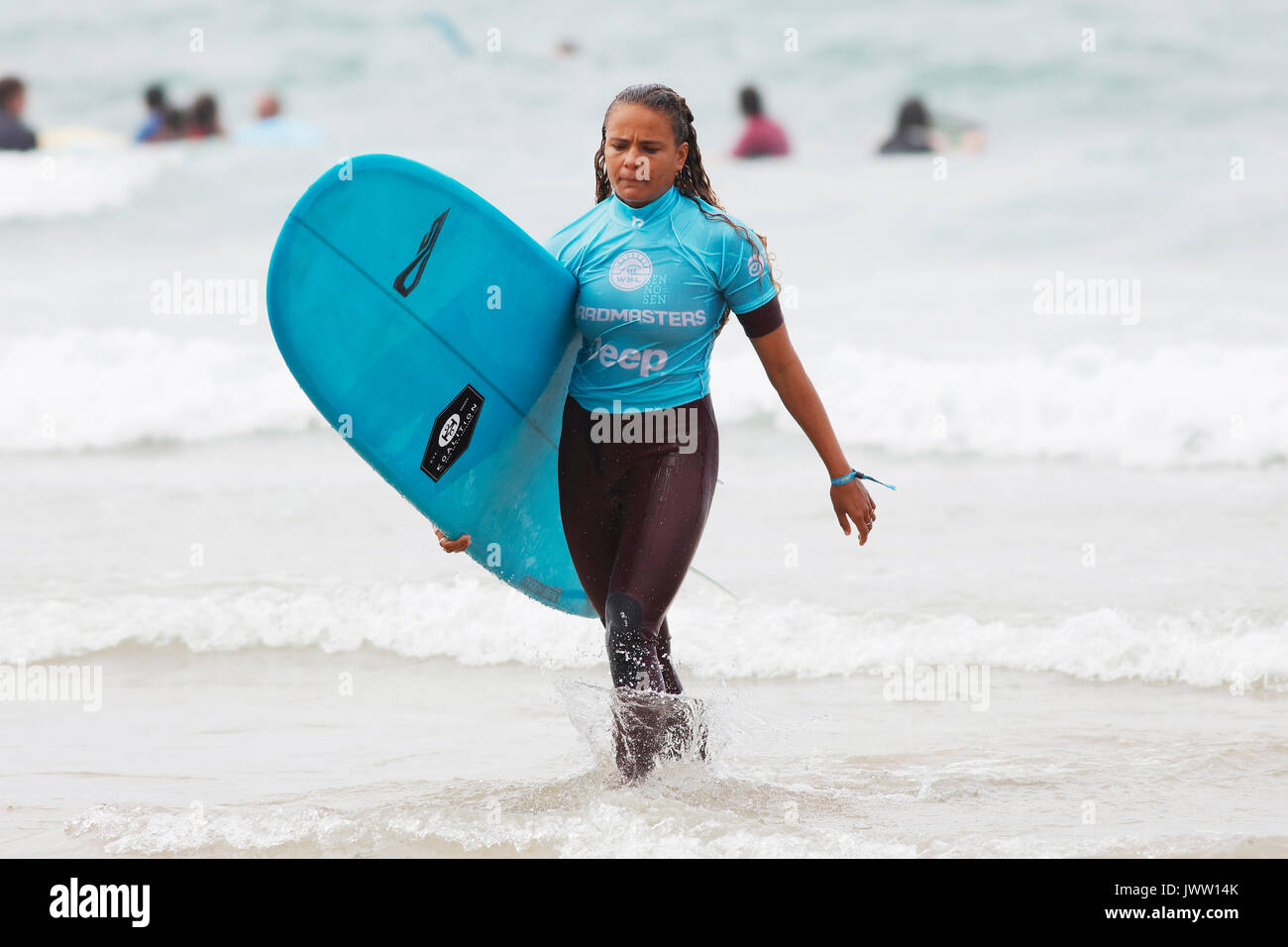 Fistral Beach, Newquay, Cornwall, UK. 13th Aug, 2017. Surfers take part in Day 5 of the Boardmasters Championship. This featured longboard surfers from around the world. Credit: Nicholas Burningham/Alamy Live News Stock Photo