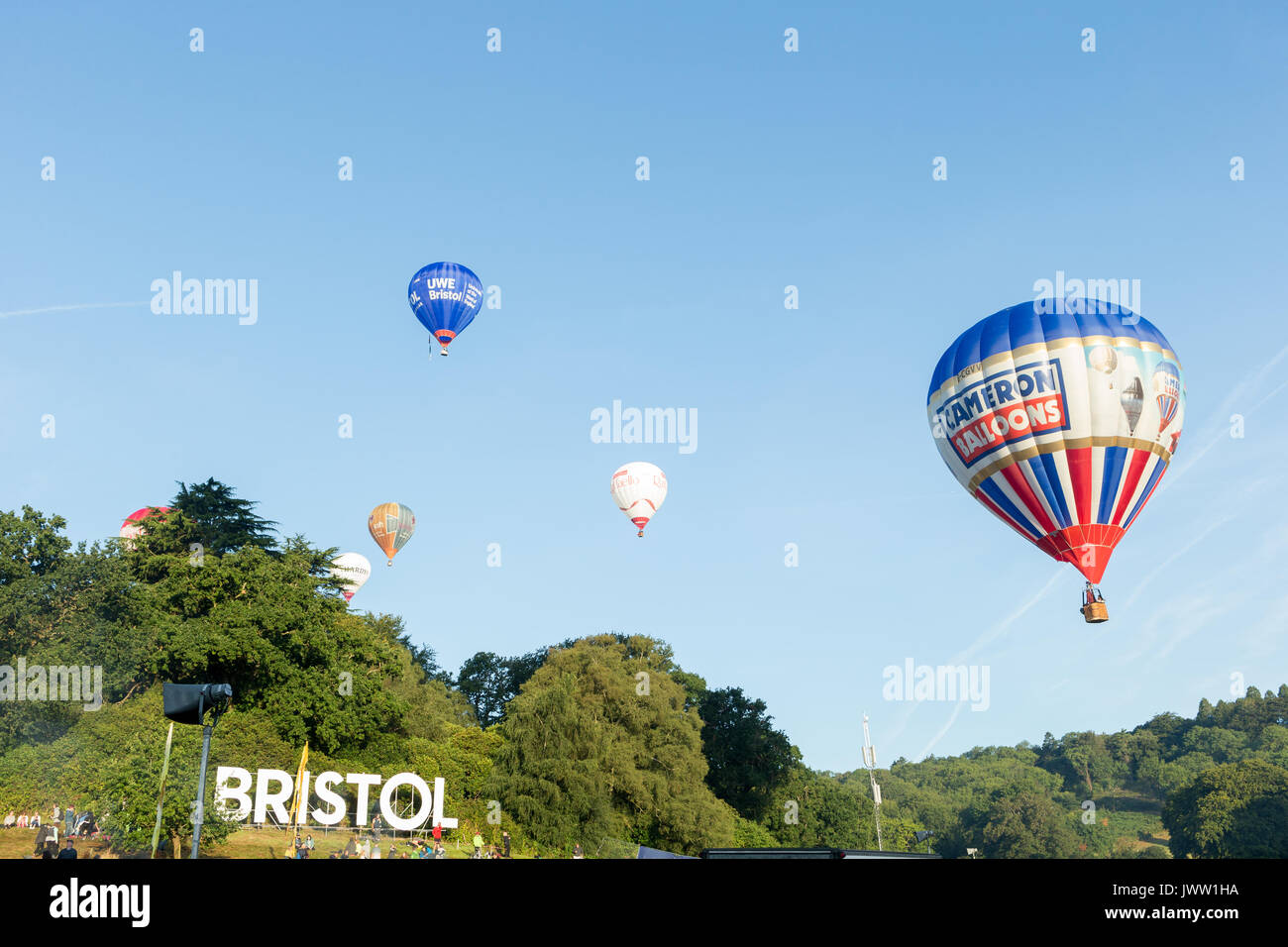 Ashton Court, Bristol, UK. 13 August 2017. The third successful mass ascent sees 111 hot air balloons launch from this year’s Bristol International Balloon Fiesta. After high winds on Saturday evening, the weather was much improved to almost perfect hot air ballooning conditions which allowed a spectacular mass ascent. The skies were filled with lots of beautiful coloured hot air balloons including a number of special shapes like the minion balloon. Credit: Neil Cordell/Alamy Live News Stock Photo