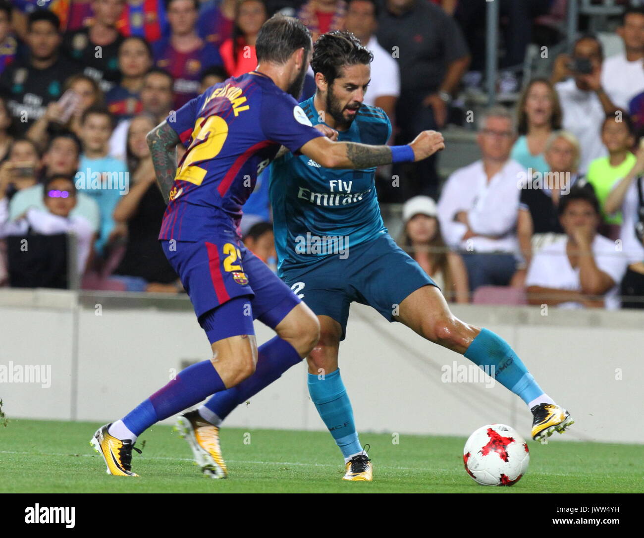 Isco in action during Supercopa de Espa–a game 1 between FC Barcelona against Real Madrid at Camp Nou Stock Photo