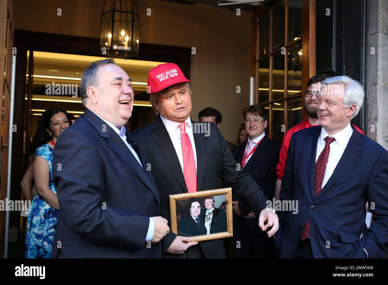 Edinburgh, Scotland, UK. 13th Aug, 2017. 'Donald Trump' (Danny Posthill, Impressionist) centre meets (left) Alex Salmond Former SNP leader and David Davis MP Secretary of State for Exiting the European Union the first guest on the Edinburgh Festival Fringe Show 'Alex Salmond' Unleashed' pictured outside the Assembly Rooms, Edinburgh Credit: Allan Milligan/Alamy Live News Stock Photo