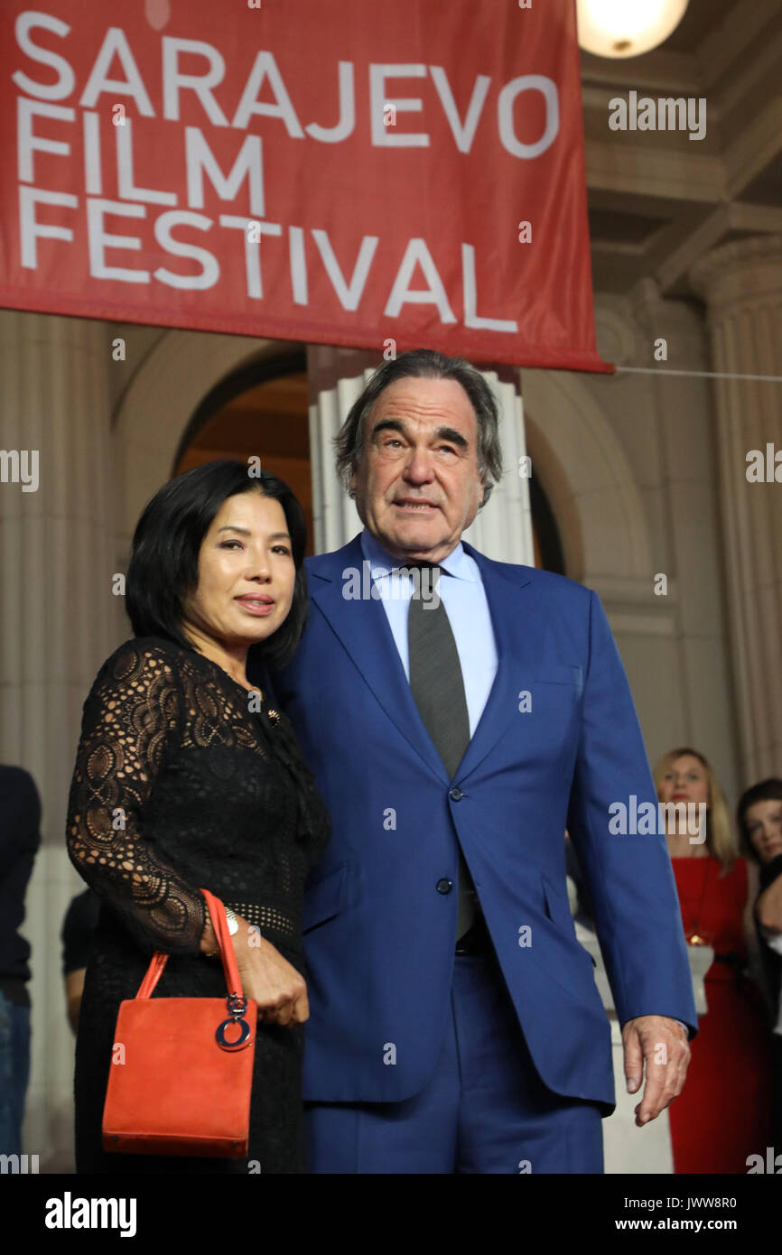 Sarajevo, Bosnia and Herzegovina. 13th Aug, 2017. Famous U.S. film director Oliver Stone (R) poses for a photo on the red carpet during the 23rd Sarajevo Film Festival(SFF) in Sarajevo, Bosnia and Herzegovina, on Aug. 13, 2017. Oliver Stone received Honorary Heart of Sarajevo on the festival for his remarkable contribution to the art of film. Credit: Haris Memija/Xinhua/Alamy Live News Stock Photo
