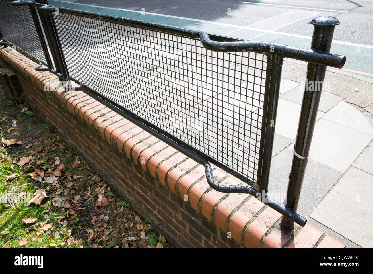 London, UK. 14th August, 2017. 'Stretcher fences' on the Glebe Estate in Peckham. A campaign has been launched by the Stretcher Railing Society to preserve 'stretcher fences' on south and east London housing estates made from over 600,000 steel ARP stretchers used during the Second World War to carry thousands of civilians wounded during the Blitz. Credit: Mark Kerrison/Alamy Live News Stock Photo
