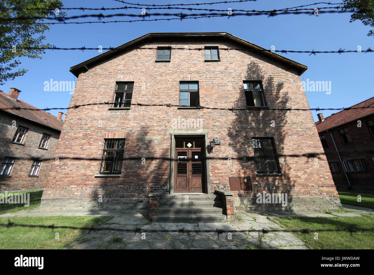 Block 23 in the former Auschwitz concentration camp is being pictured on 26 June 2017. Block 23 and other blocks, all separately blocked with barbed wire, were used to jail Russian prisoners of war. The major paramilitary organization in Nazi Germany, SS (Schutzstaffel, lit. 'Protection Squadron'), ran the concentration and death camp between 1940 and 1945. Approximately 1.1 to 1.5 million people, most of them Jewish, have been killed in the camp and its satellites. Auschwitz stands as the symbol for the industrialized mass murder and the holocaust of Nazi Germany. Photo: Jan Woitas/dpa-Zentr Stock Photo