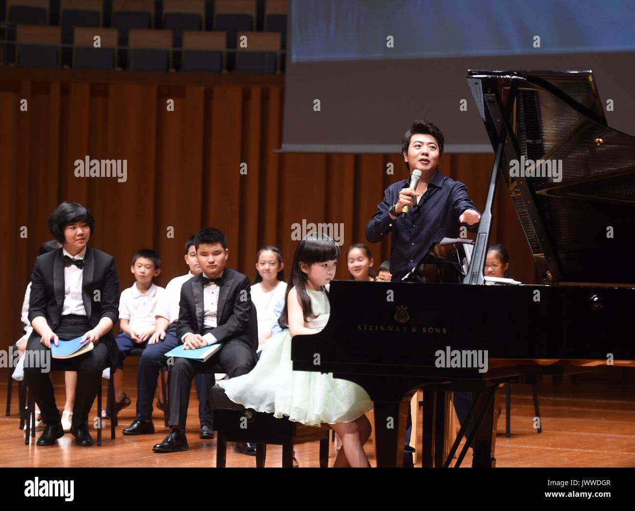 Beijing, China. 14th Aug, 2017. Pianist Lang Lang instructs children at ...