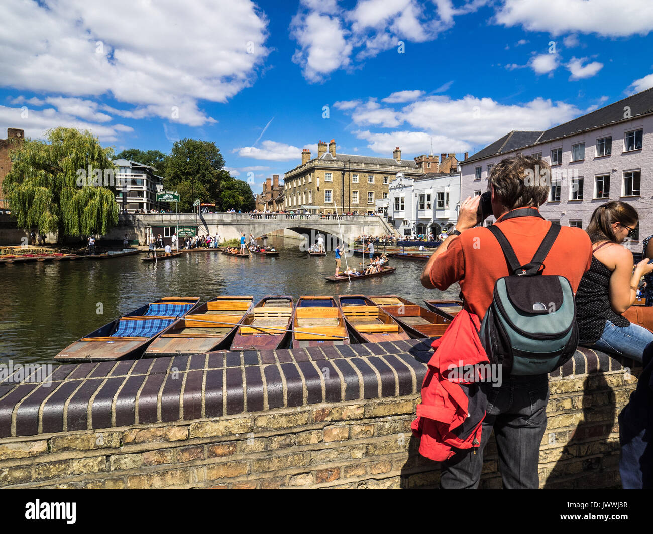 Tourist photographing punts on the River Cam in Cambridge UK Stock Photo