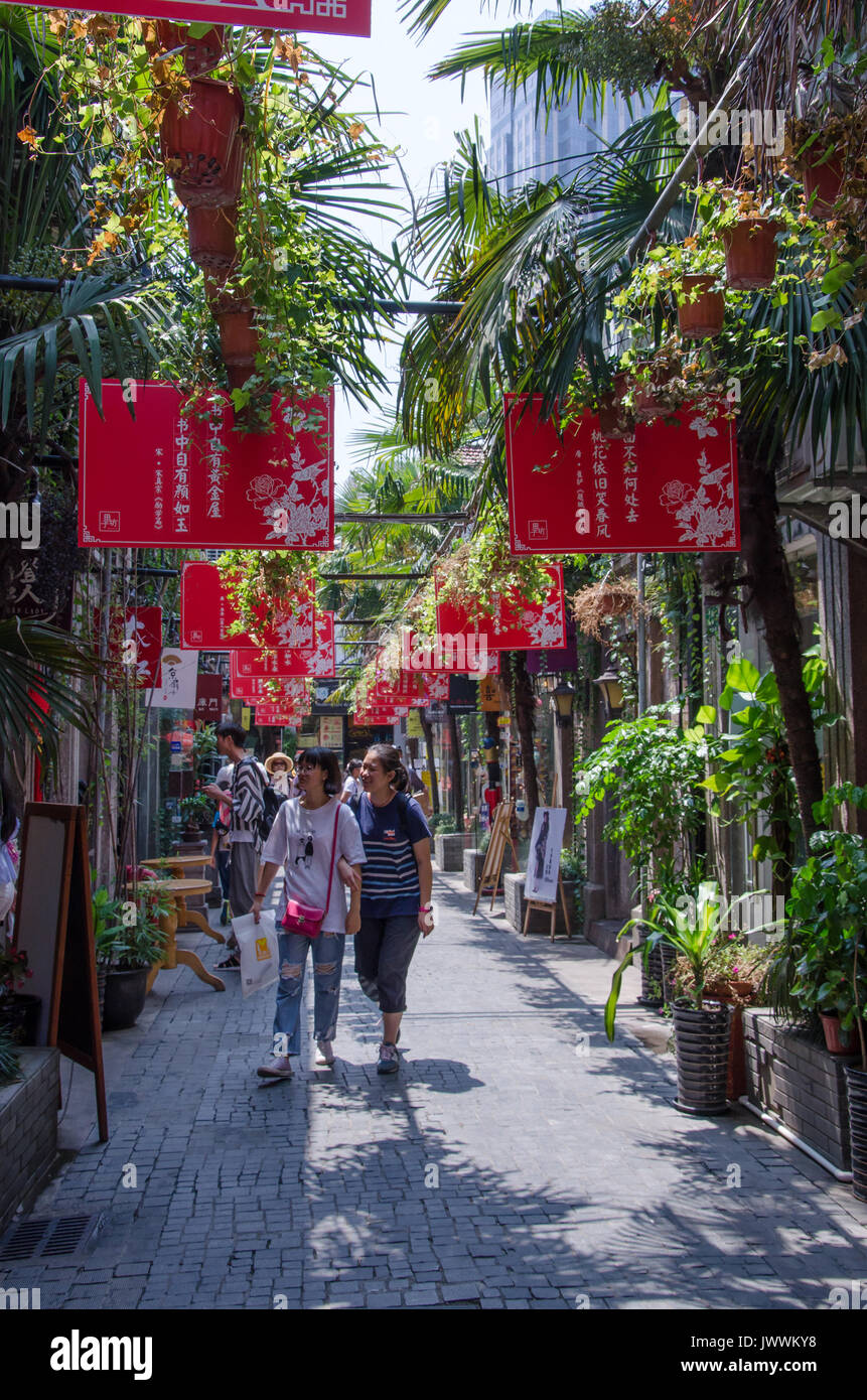 Tourists wander through the alleyway of Tianzifang in Shanghai, China. Stock Photo