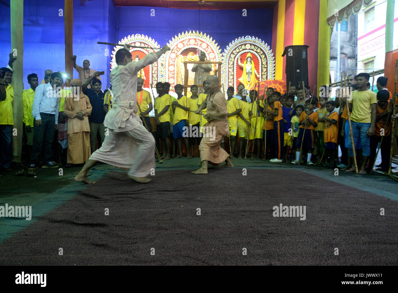 Kolkata, India. 13th Aug, 2017. Bharat Sevasaram Sangha sanyassi or holy men and student takes part in a traditional Lathi Khela or Stick Fight game on the occasion of Krishna Janmastami on August 13, 2017 in Kolkata. Credit: Saikat Paul/Pacific Press/Alamy Live News Stock Photo