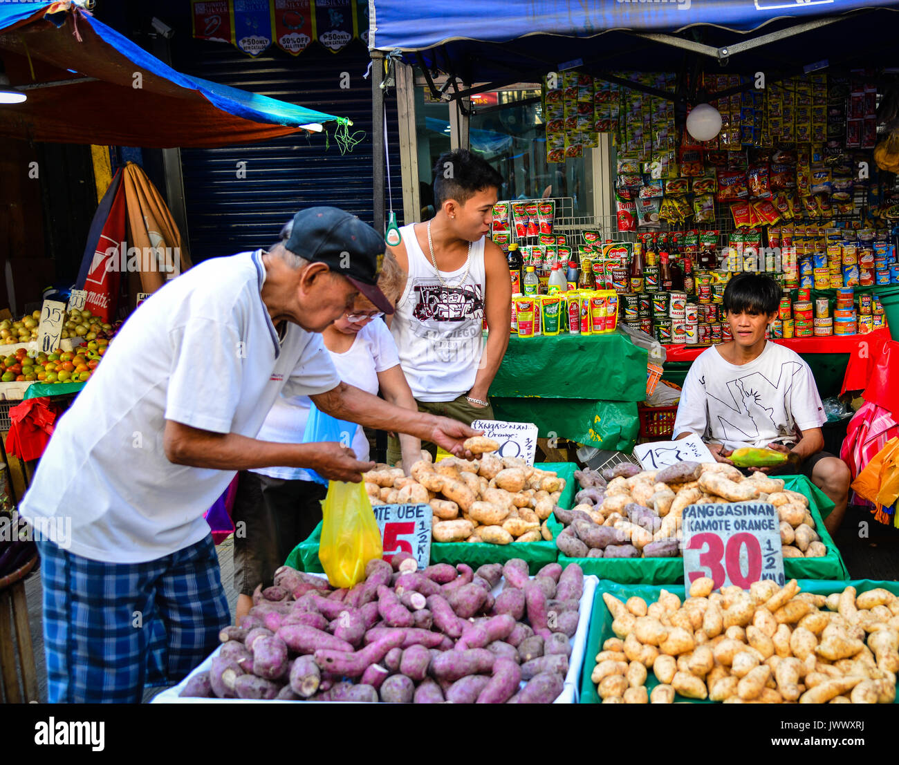 Manila, Philippines - Apr 12, 2017. Vendors sell food at street market