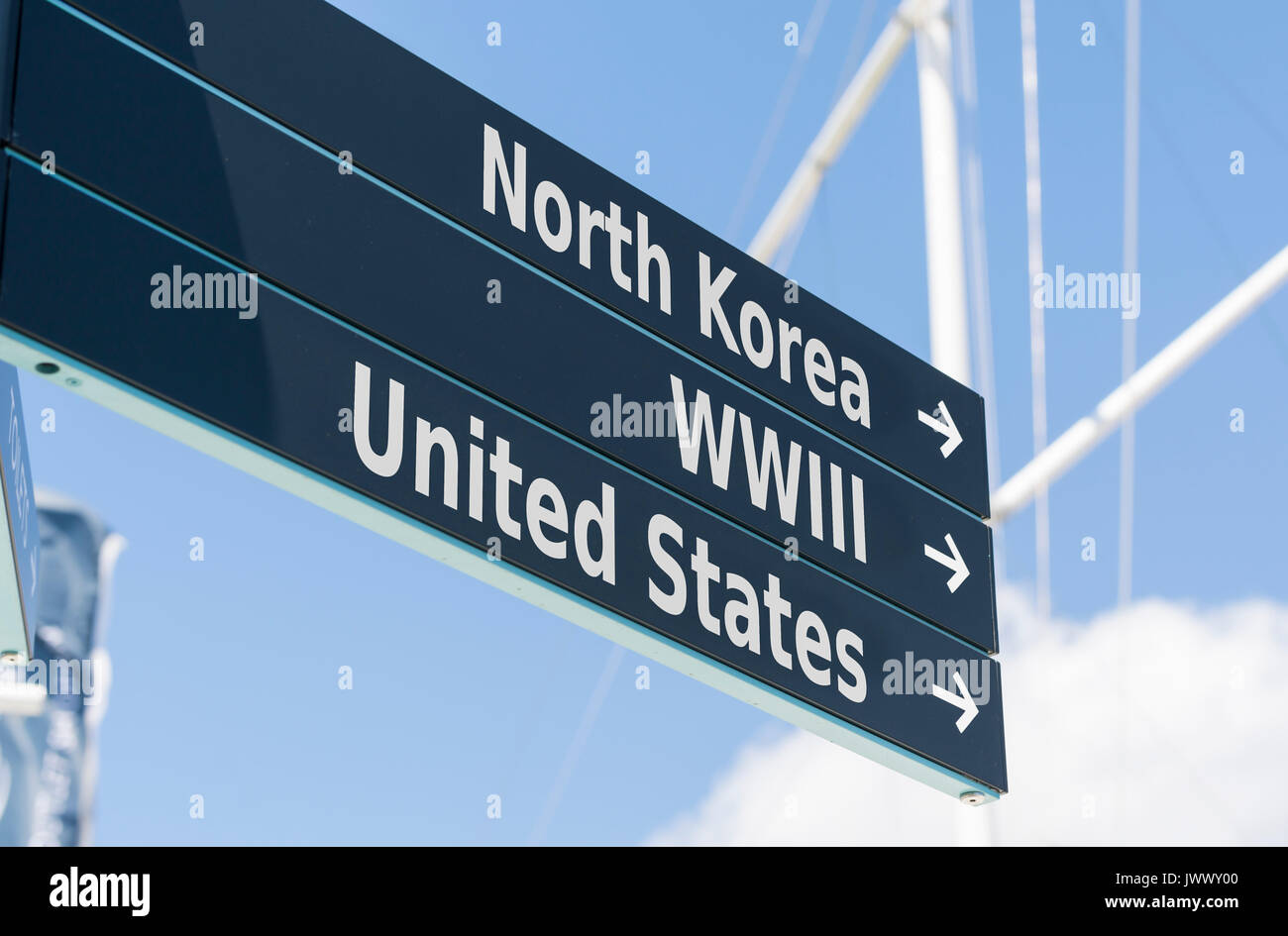 Sign pointing to North Korea, United States of America (USA) and WWIII (World War 3, WW3). Stock Photo