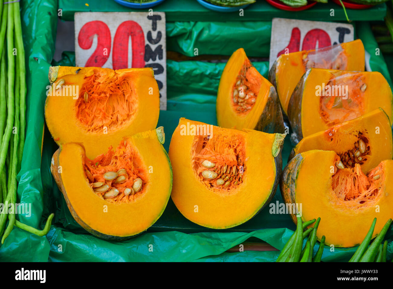 Slice of yellow pumpkin at rural market in Manila, Philippines Stock ...