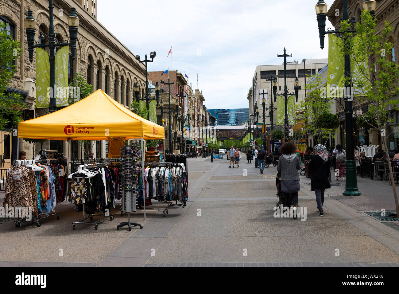 The View Down 8 Avenue SE Stephen Avenue SE in Downtown Calgary Alberta Canada with Street Trader Selling Clothing Stock Photo