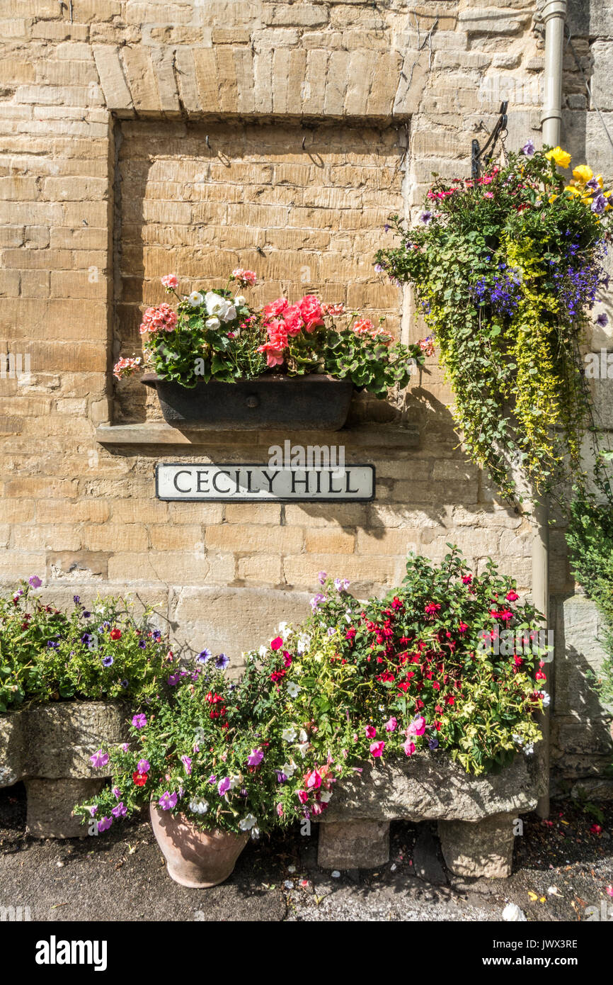 Flower display, Cecily Hill (street renowned for its collection of beautiful period property), Cirencester, Gloucestershire, England, UK. Stock Photo