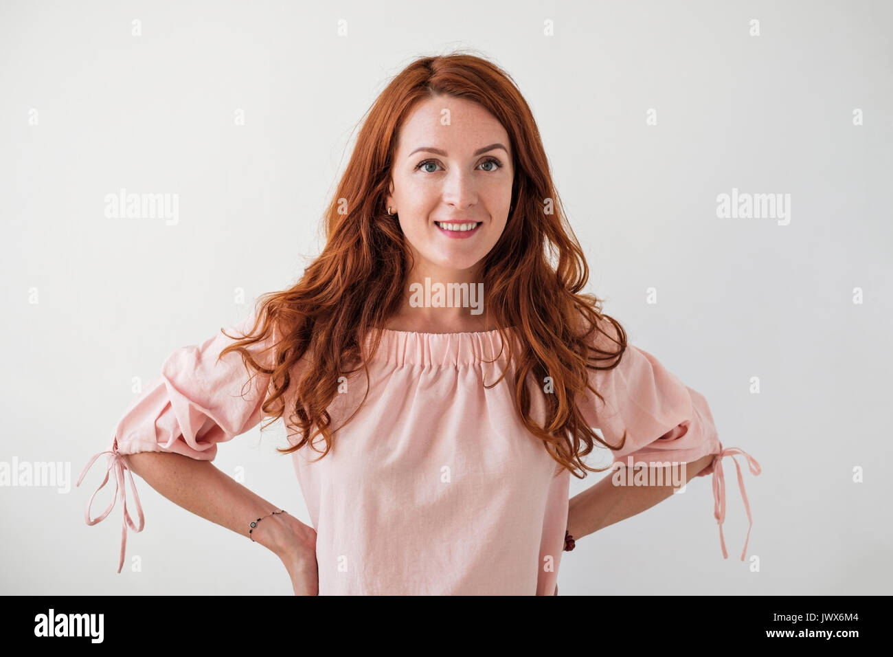 Caucasian woman model with ginger hair posing indoors Stock Photo