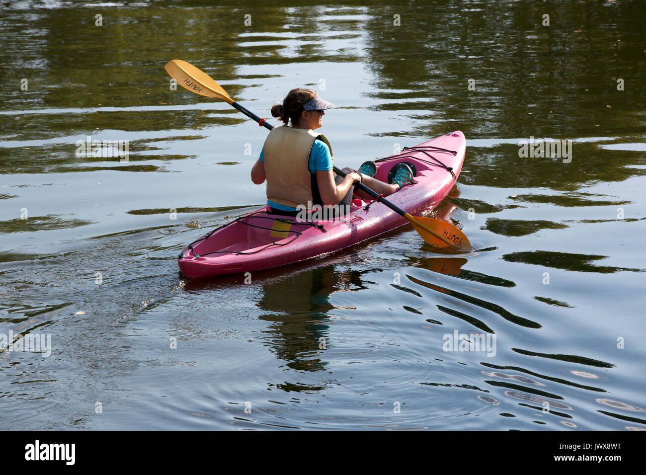 Woman in a kayak on the Esplanade, Charles River Boston Massachusetts