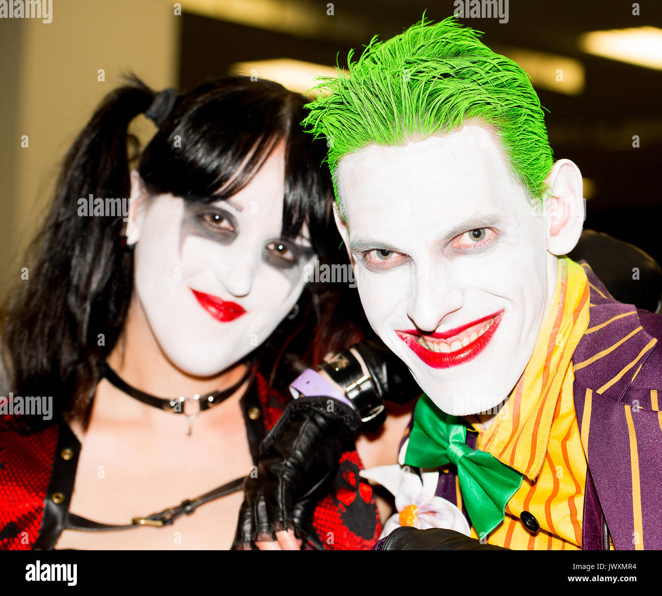 Couple dressed as Harley Quinn and The Joker from the Batman comics at the London Film & Comic Con 2017 (Press pass/permission obtained). Stock Photo