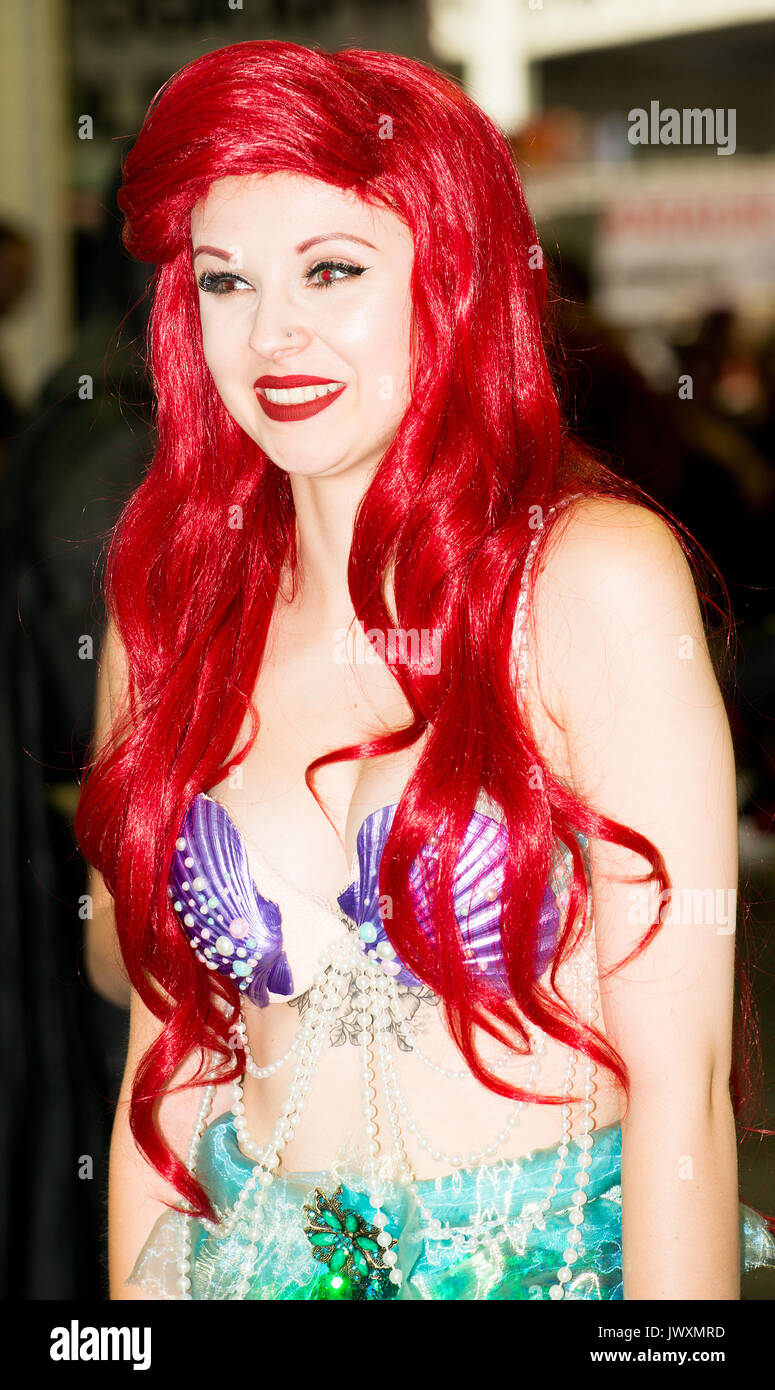 Young woman dressed as Ariel from Walt Disney's The Little Mermaid film at the London Film & Comic Con 2017 (Press pass/permission obtained). Stock Photo