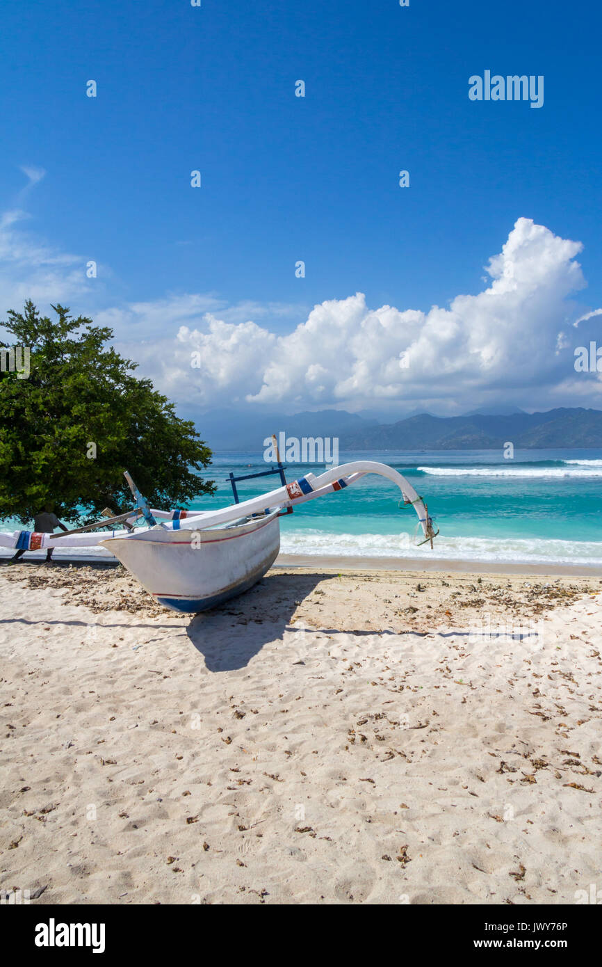 Jukung outrigger boat on a white sand beach  on Gili Trawangan, Indonesia Stock Photo