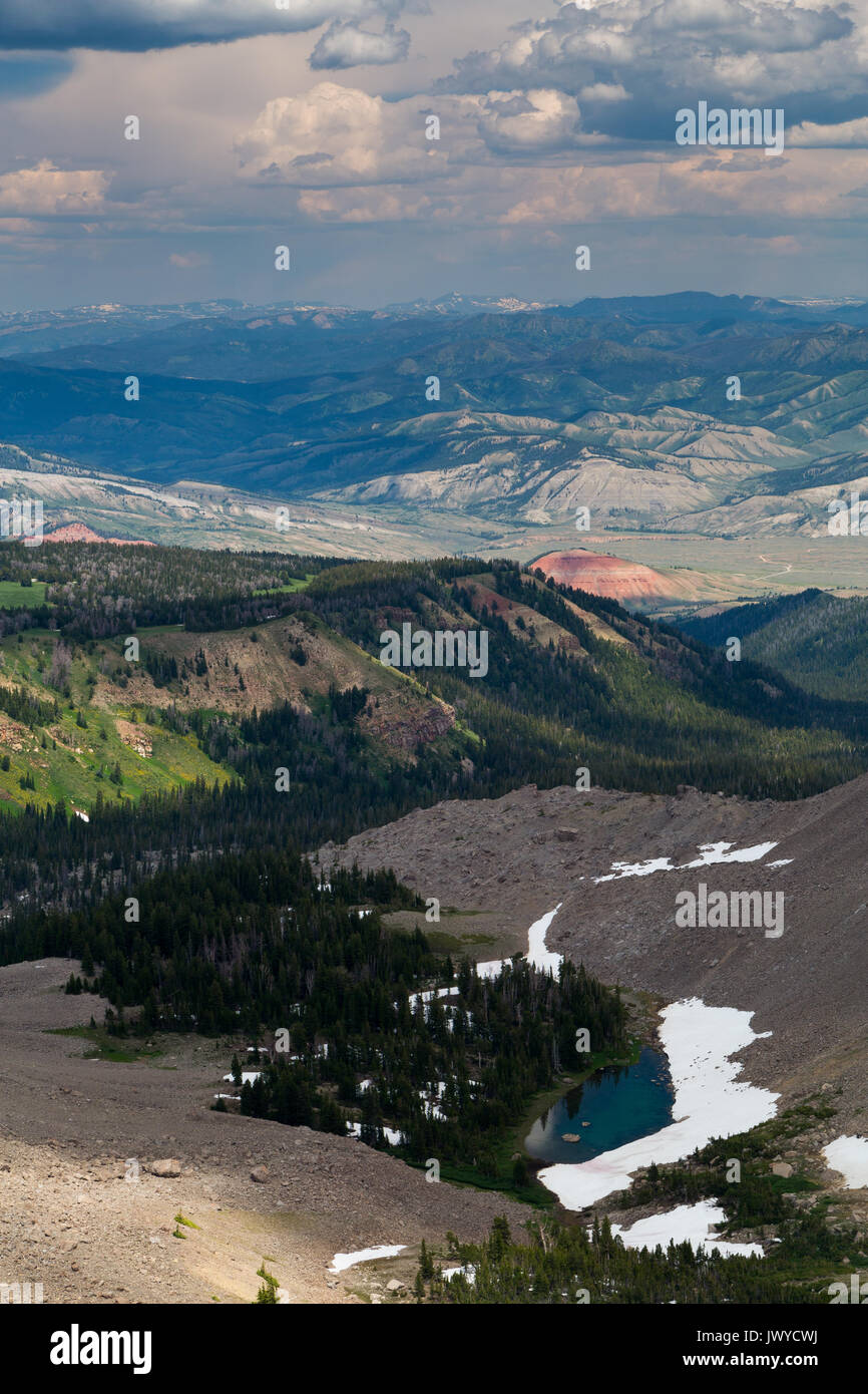 The rolling hills of the northern Gros Ventre Mountains extending beyond a small alpine lake below the summit of the Sleeping Indian, aka Sheep Mounta Stock Photo
