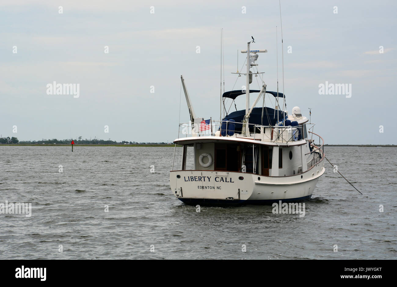 A pleasure boat anchored in Shallowbag Bay off of the town of Manteo on