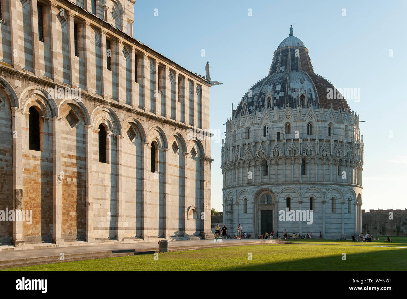 Romanesque Battistero di San Giovanni (Baptistery of St. John) and Cattedrale Metropolitana Primaziale di Santa Maria Assunta (Pisa Cathedral) on Camp Stock Photo