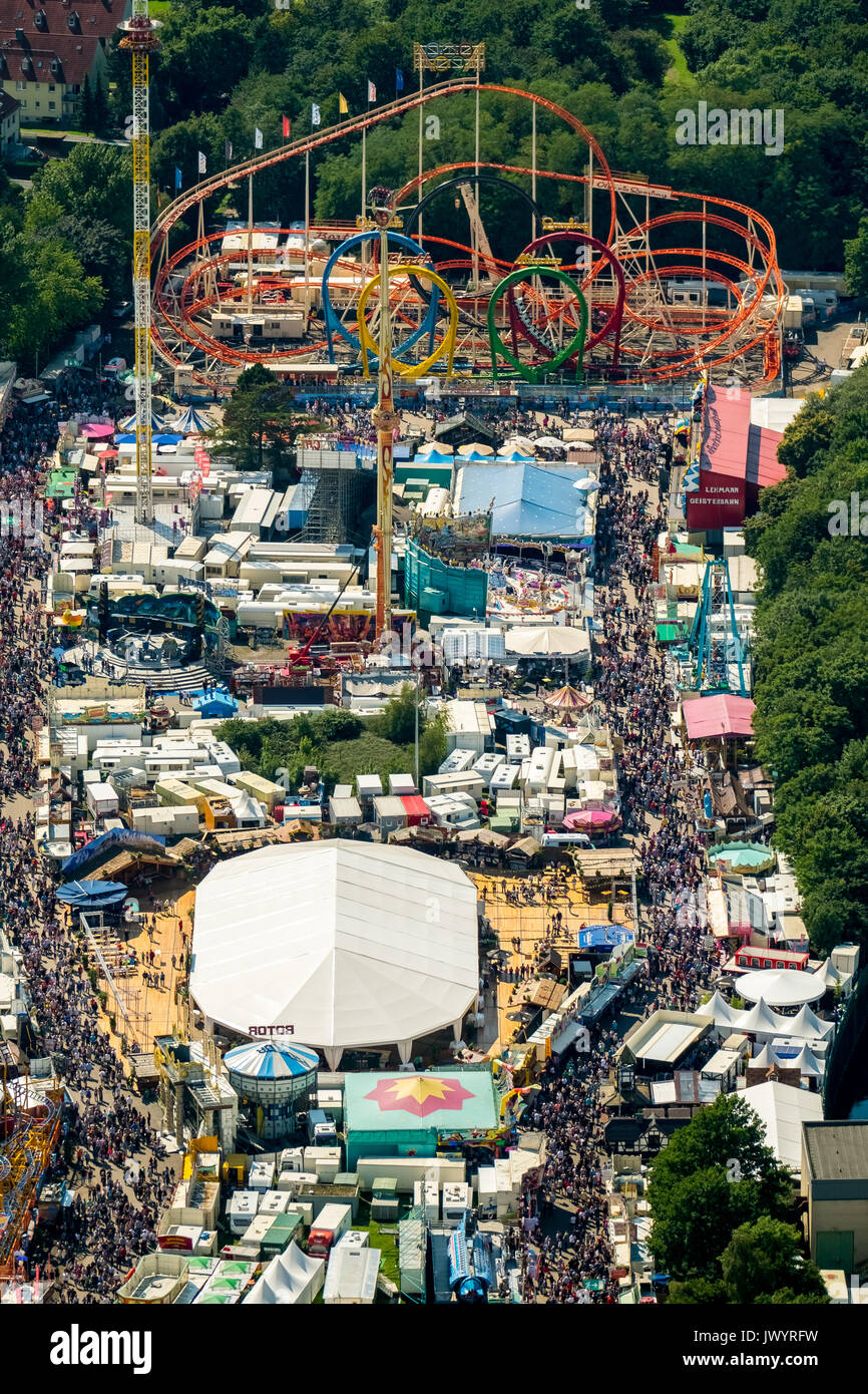 582. Cranger fair, fairground carousel, roller coaster, Ferris wheel, observation tower, rides, fair attractions, festival, audience chains karussel,  Stock Photo
