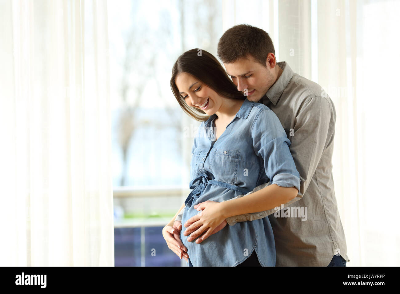 Pregnancy Mom Dad Hugging Belly Hi Res Stock Photography And Images Alamy