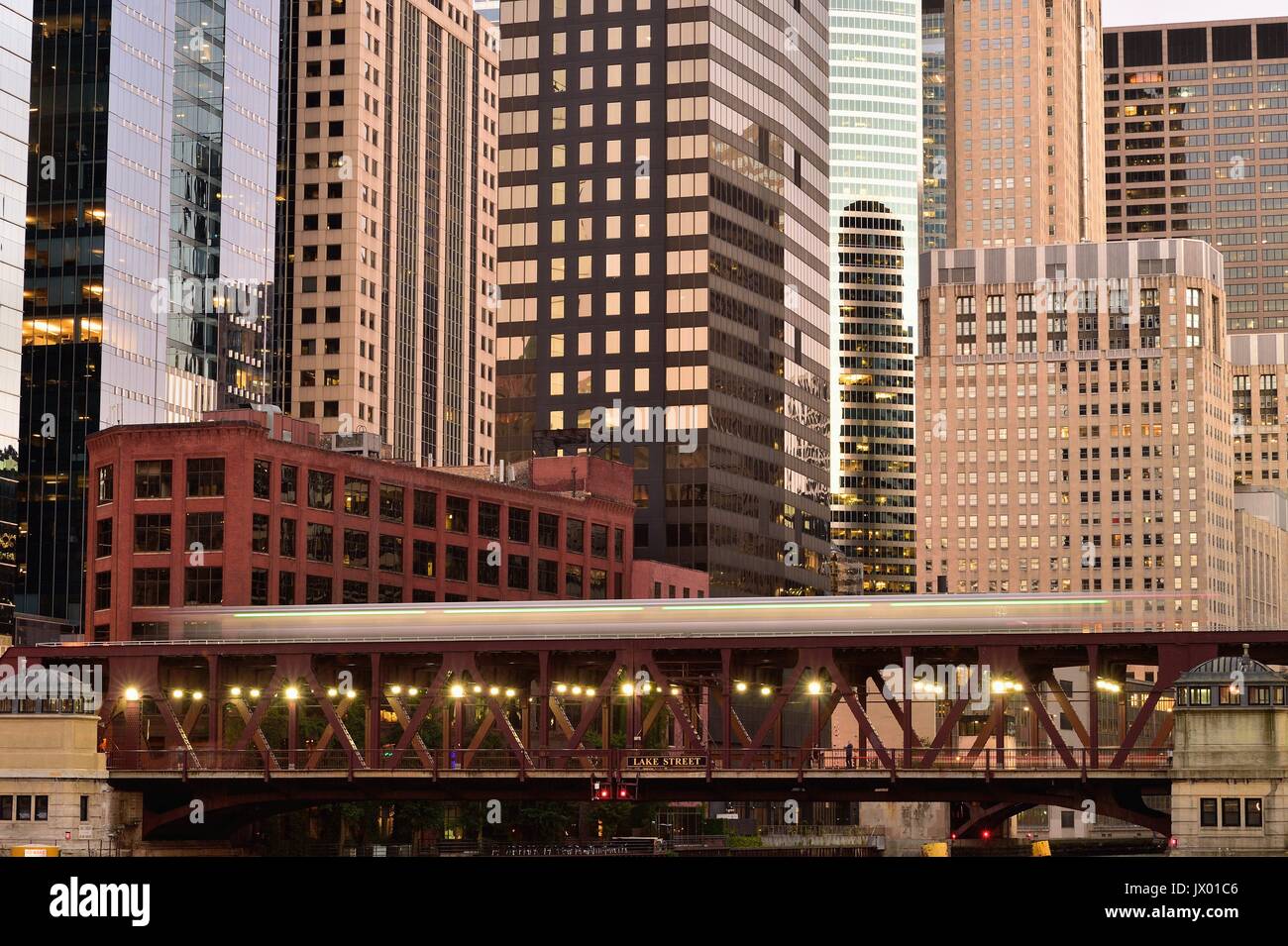A Chicago CTA Pink Line train streaks across the Chicago River on the