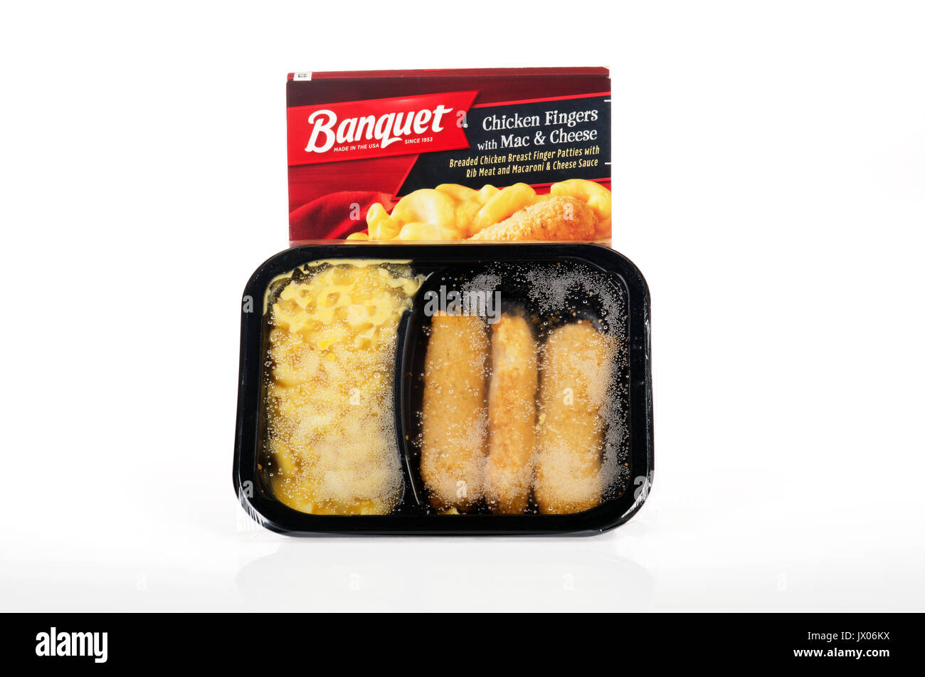 Cooked Banquet frozen chicken fingers  with mac and cheese ready meal dinner with packaging on white background cutout USA Stock Photo