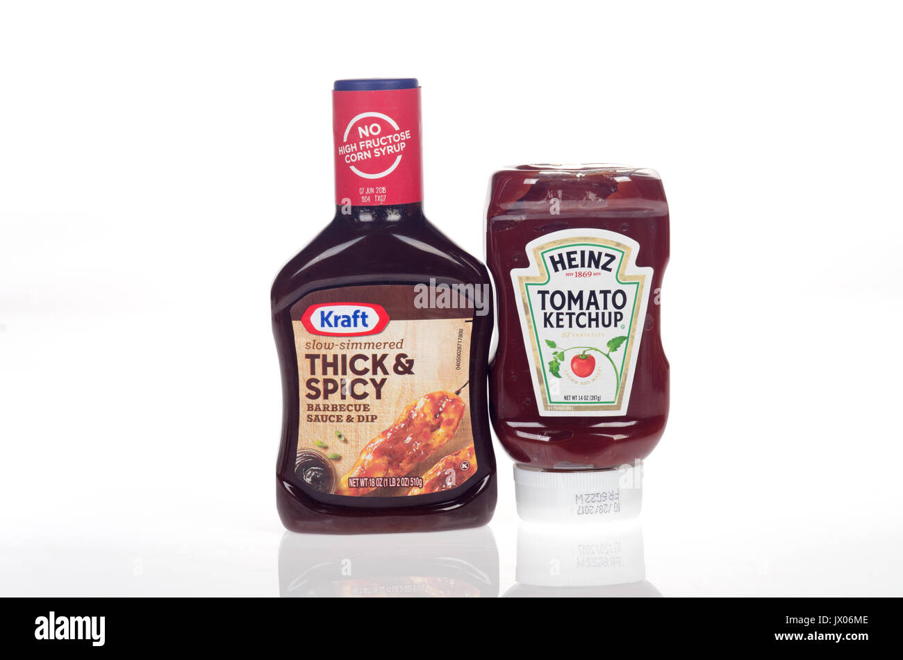 Bottle of Kraft bbq sauce with bottle of Heinz ketchup on white background, cut-out. USA Stock Photo -