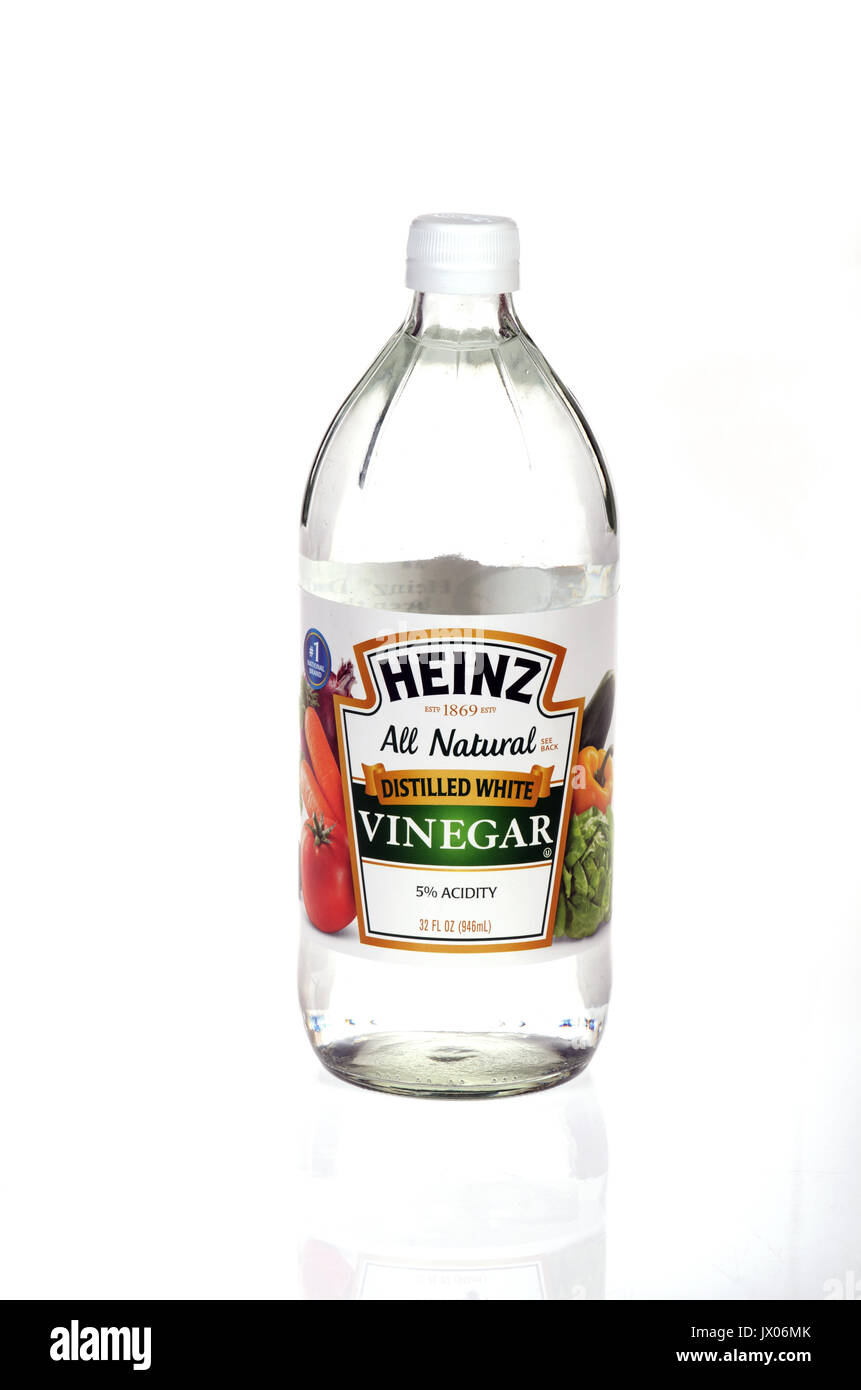 Unopened bottle of Heinz distilled white vinegar isolated on white background. USA Stock Photo