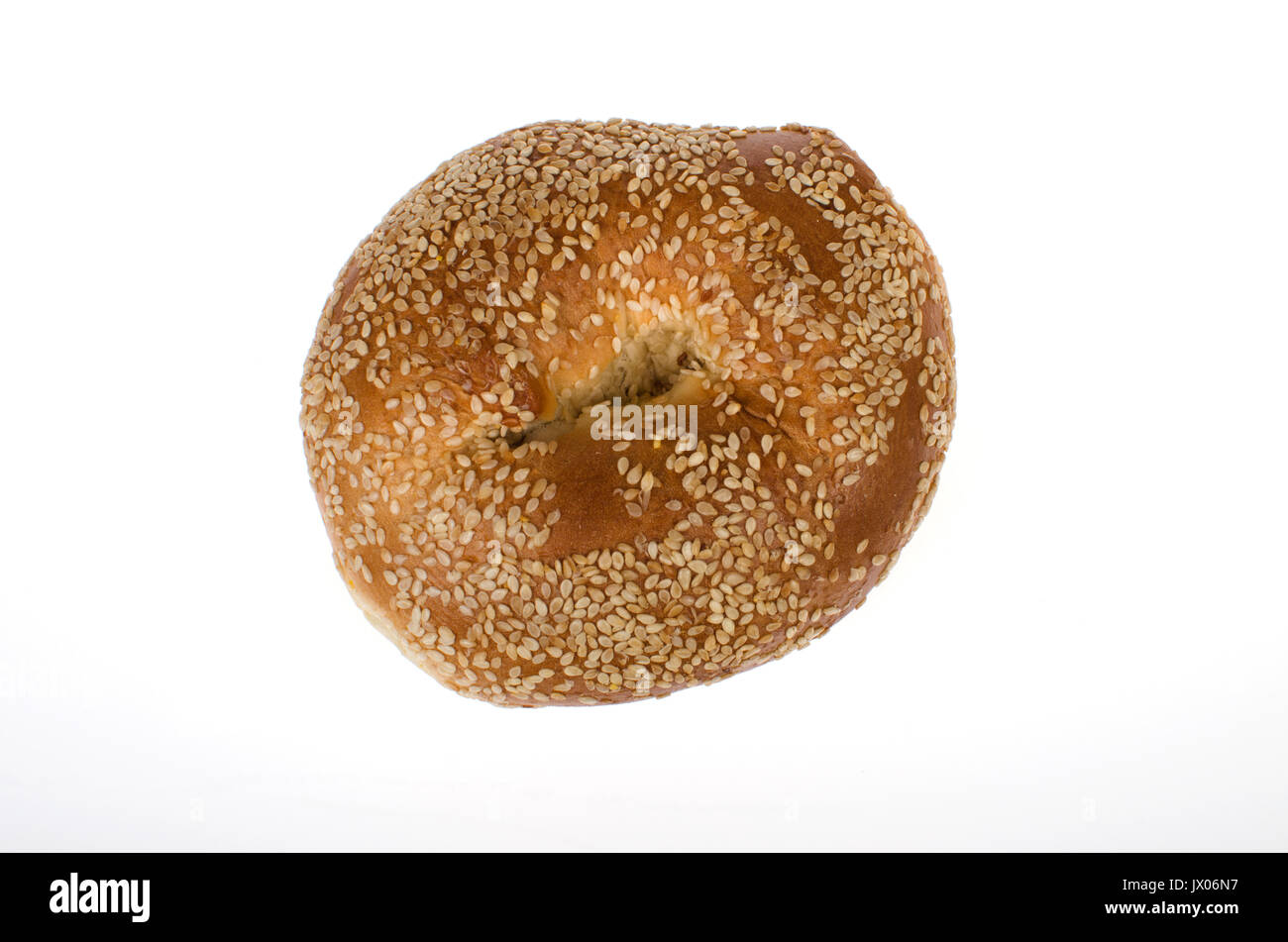 Single Sesame seed bagel on white background, cut out. Stock Photo