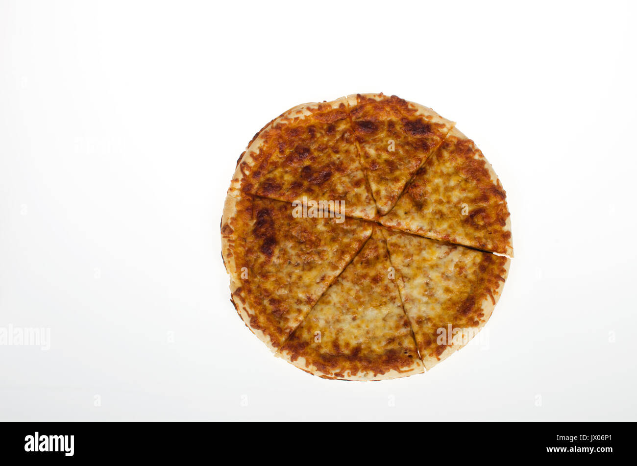 Freshly  cooked whole cheese pizza  cut in slices on white background, cut-out. USA Stock Photo