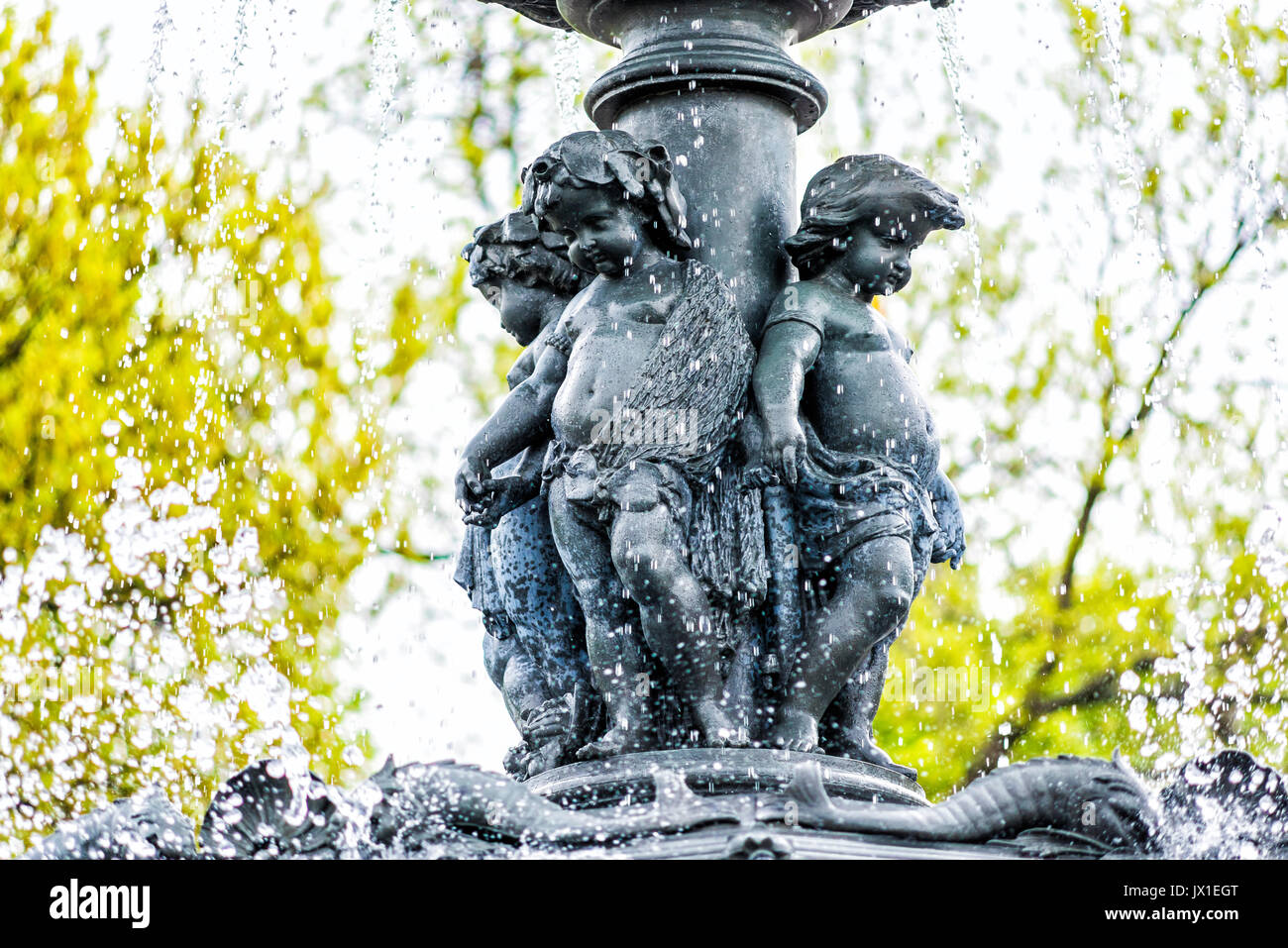 Quebec City, Canada - May 30, 2017: Large water fountain in summer on Avenue Honore Mercier with little greek boy sculptures Stock Photo