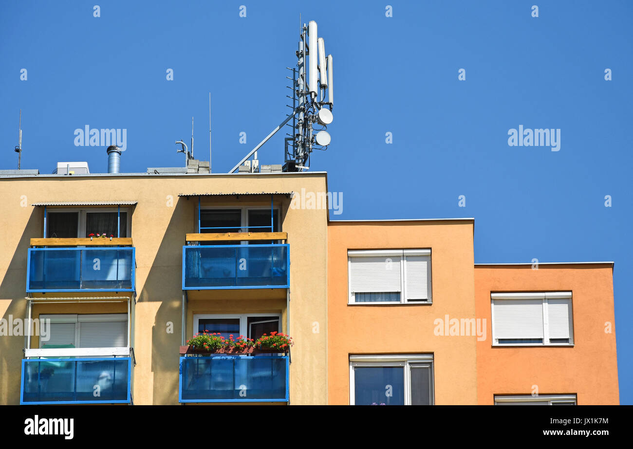 Antennas on the top of an apartment building Stock Photo Alamy