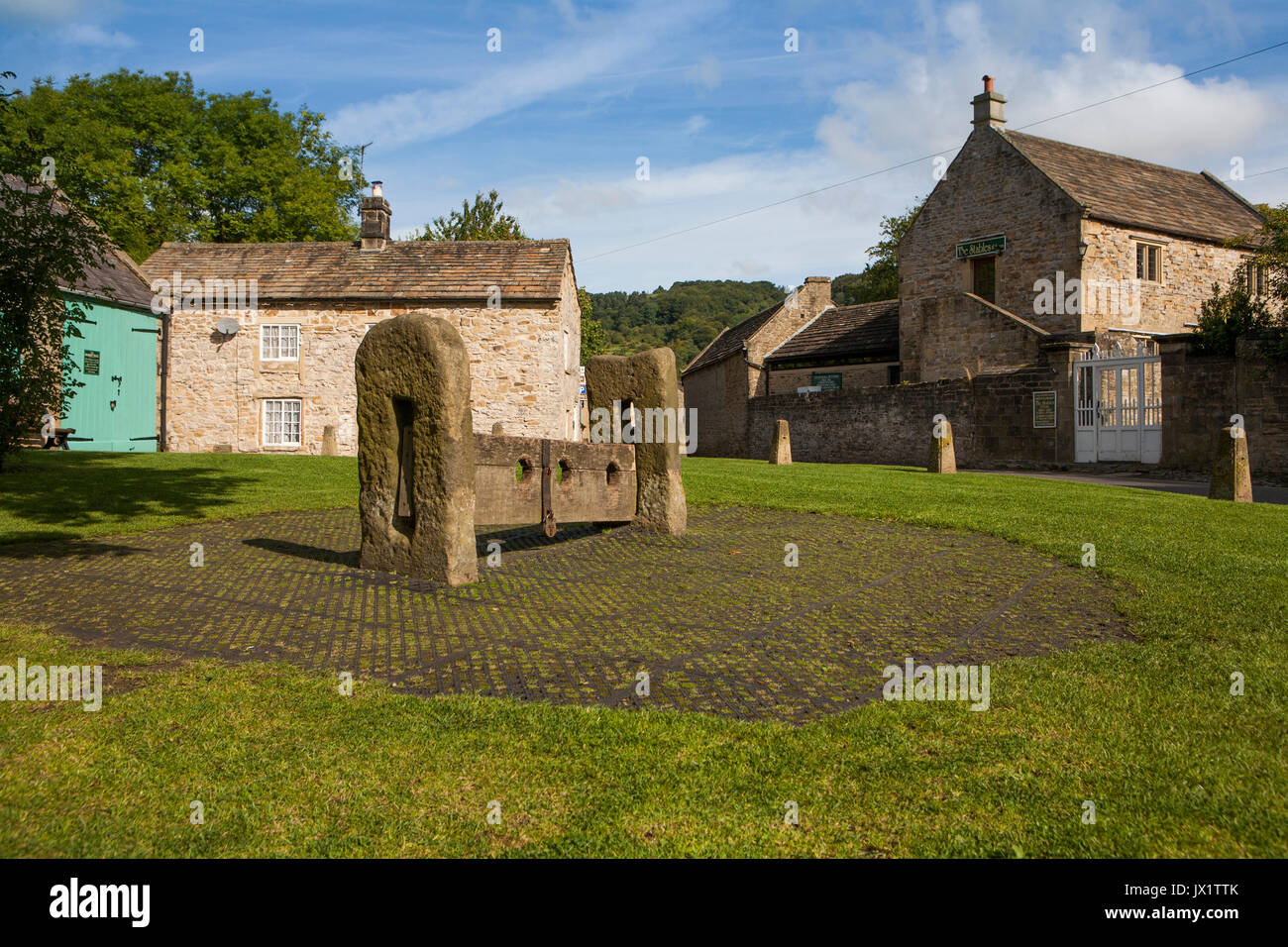 Ancient Stocks on Eyam village green, Plague Village, Derbyshire Stock Photo