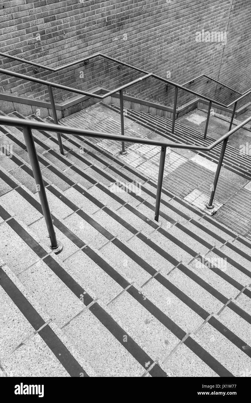 Concrete flight of steps & steel handrails. For urban life, climbing career ladder, corporate ladder, getting on property ladder, staircase to nowhere Stock Photo