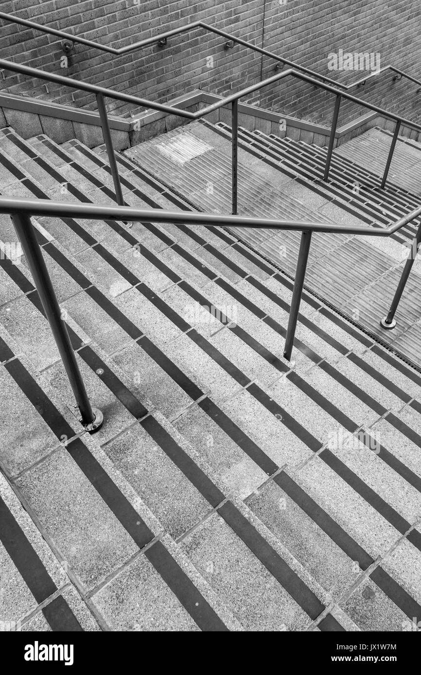 Concrete flight of steps & steel handrails. For urban life, climbing career ladder, corporate ladder, getting on property ladder, staircase to nowhere Stock Photo