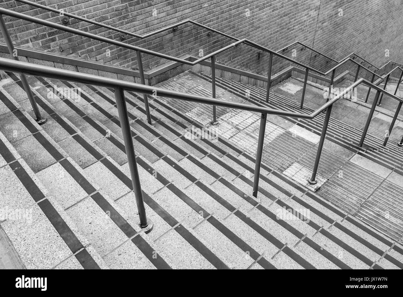 Concrete flight of steps & steel handrails. For urban life, climbing career ladder, corporate ladder, getting on property ladder, staircase to nowhere Stock Photo