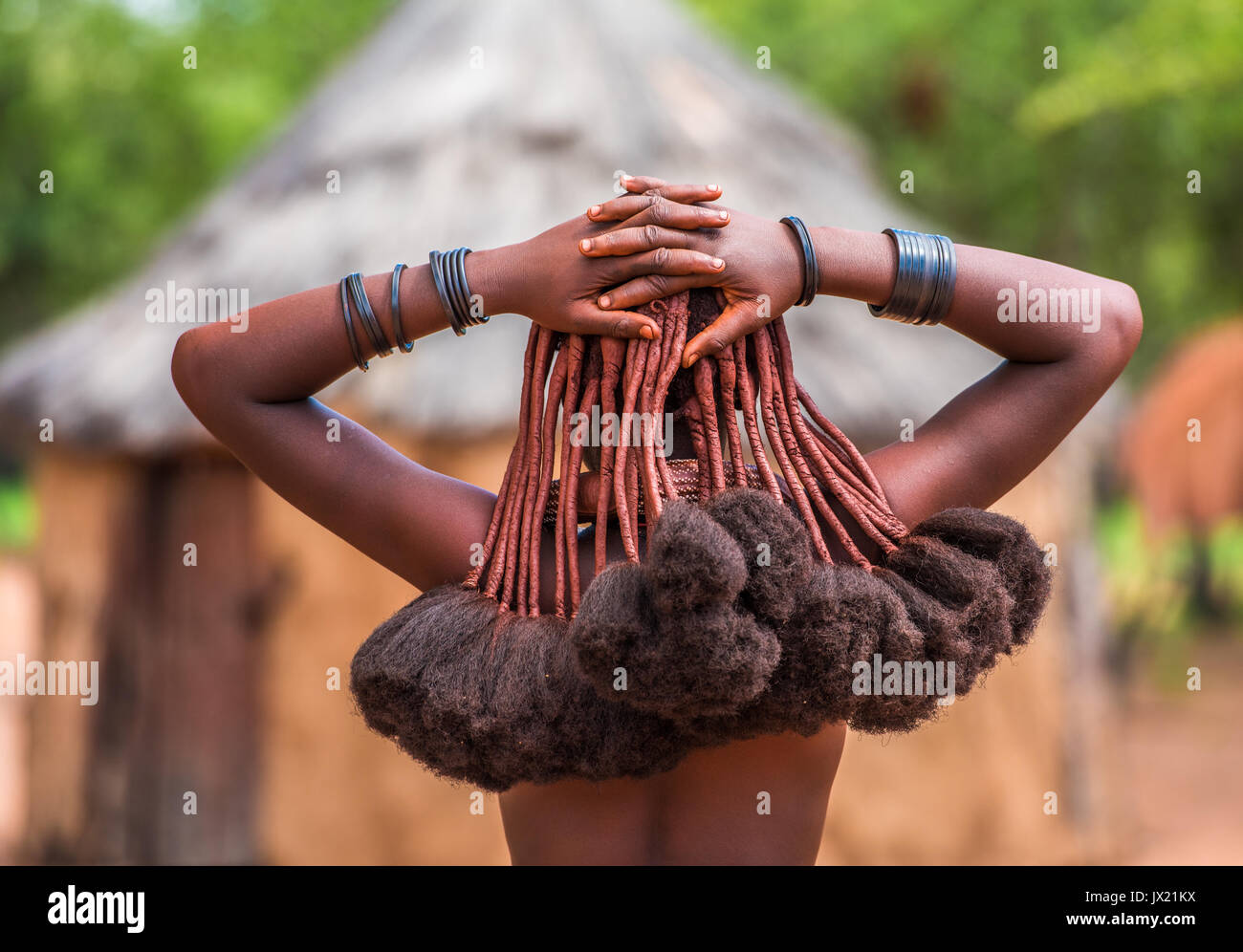 Hair style of Himba women, tribespeople living in northern Namibia Stock Photo
