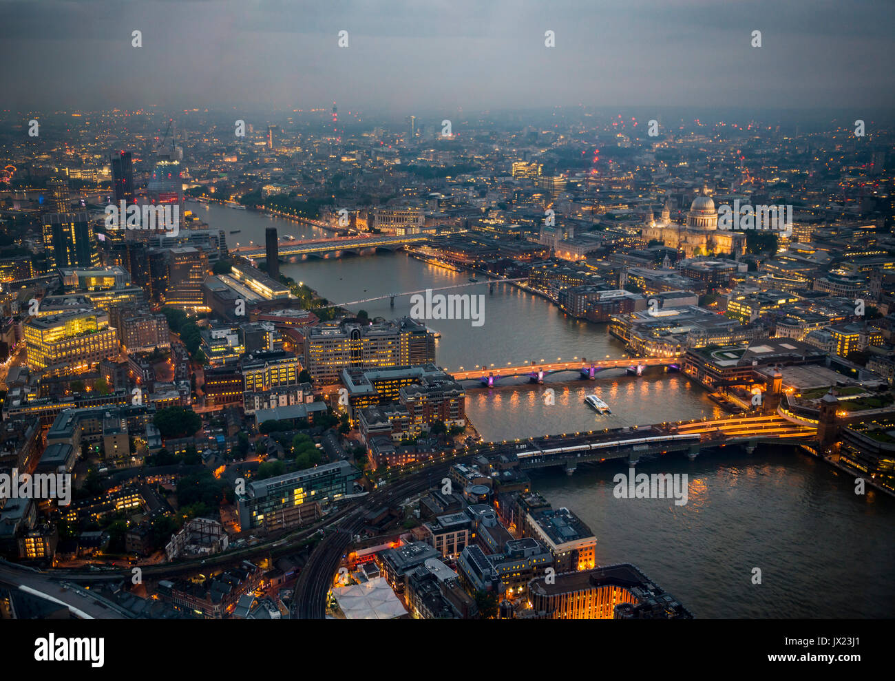 View of River Thames with London Bridge, Millenium Bridge and St. Paul's Cathedral, dusk, aerial view, London, England Stock Photo